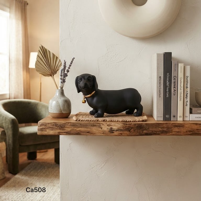 Articulo decorativo perro salchicha negro detalle dorado 22cm* 9cm* 13cm